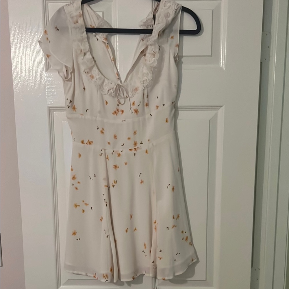Floral White Romper with Ruffle Details
